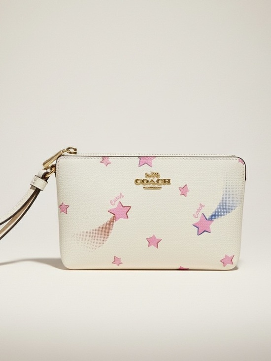 Coach Handbags - Coach Corner Zip Wristlet with Disco Star Print Coated Canvas. EUC